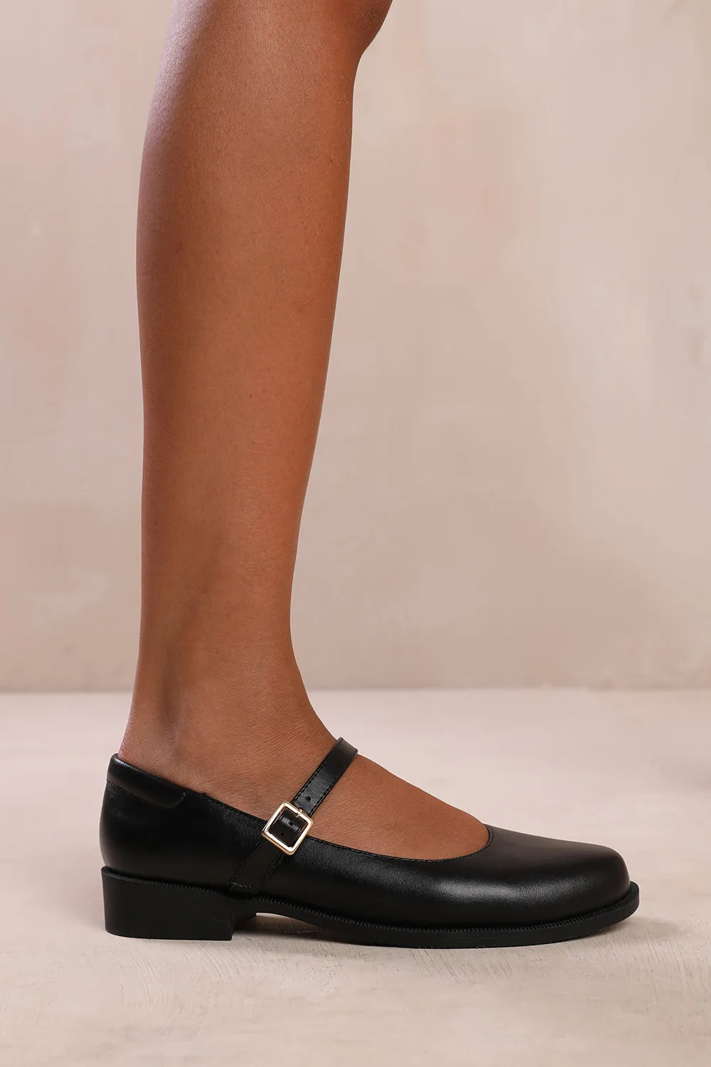 KINGSTON LOW HEEL LOAFER WITH STRAP AND BUCKLE DETAIL IN BLACK FAUX LEATHER